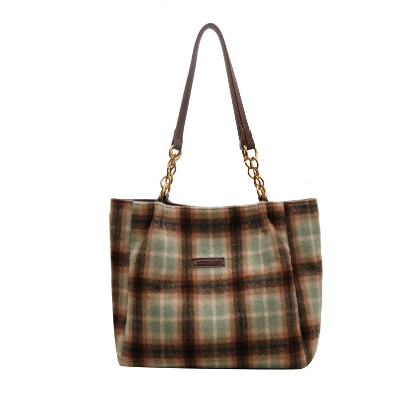 Vue latérale du Sac Carreli™ mettant en valeur sa texture rétro